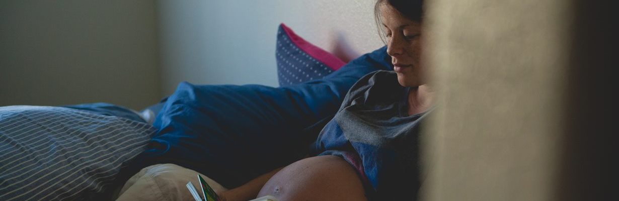 young pregnant woman reading - Photo by Josh Willink from Pexels