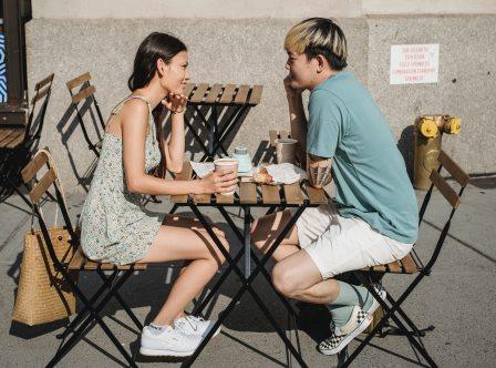 young couple talking over coffee
