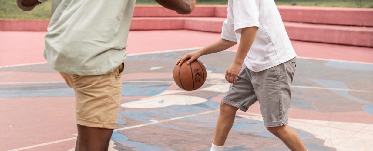 young men playing basketball - photo by monstera for pexels.com