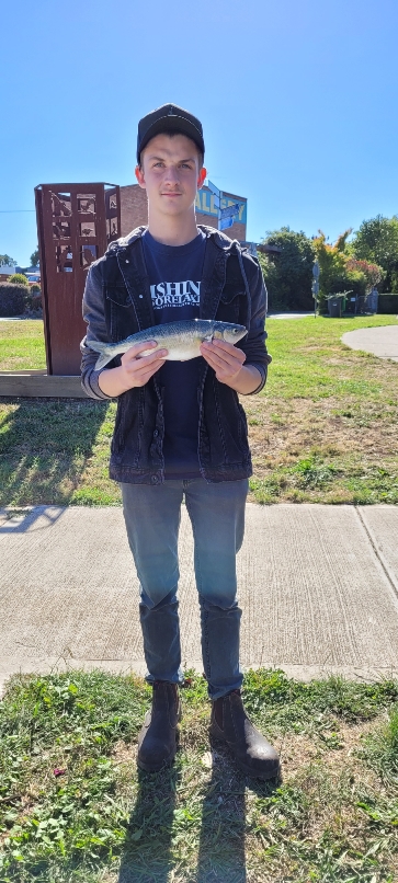 Adam holding a fish