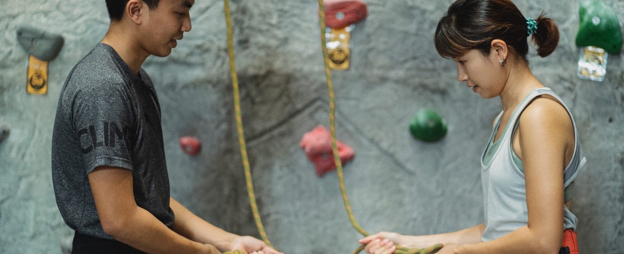 young people at a climbing wall