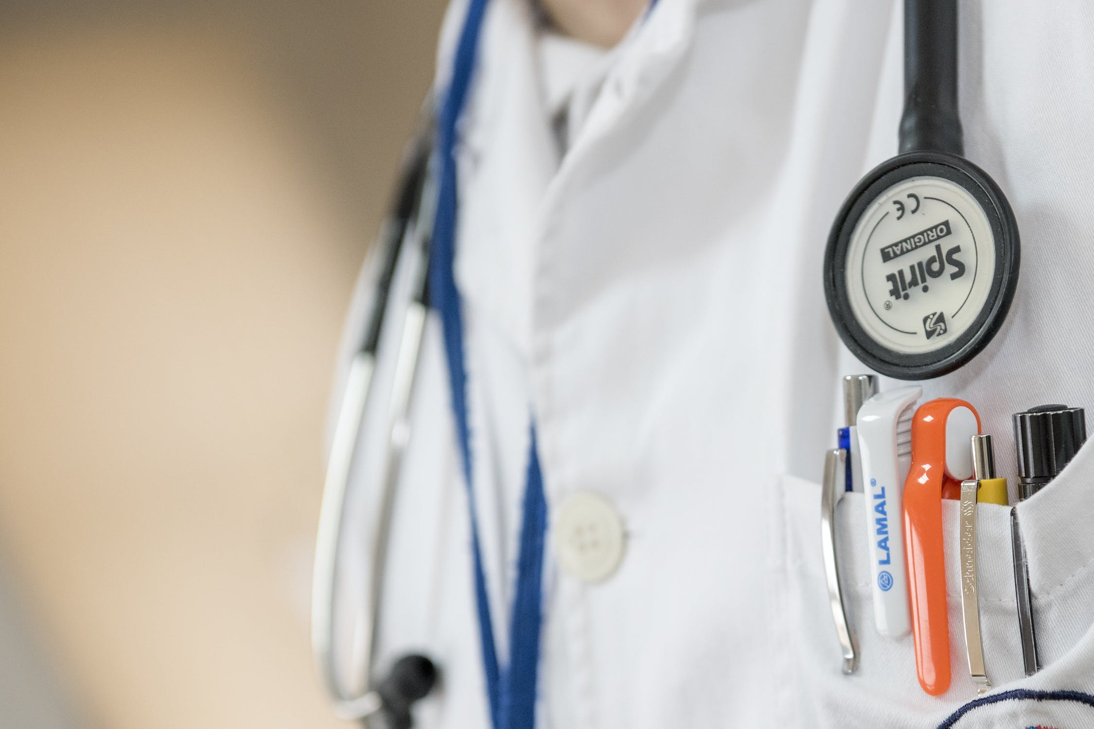Image of doctors coat with pens in pocket and stethoscope